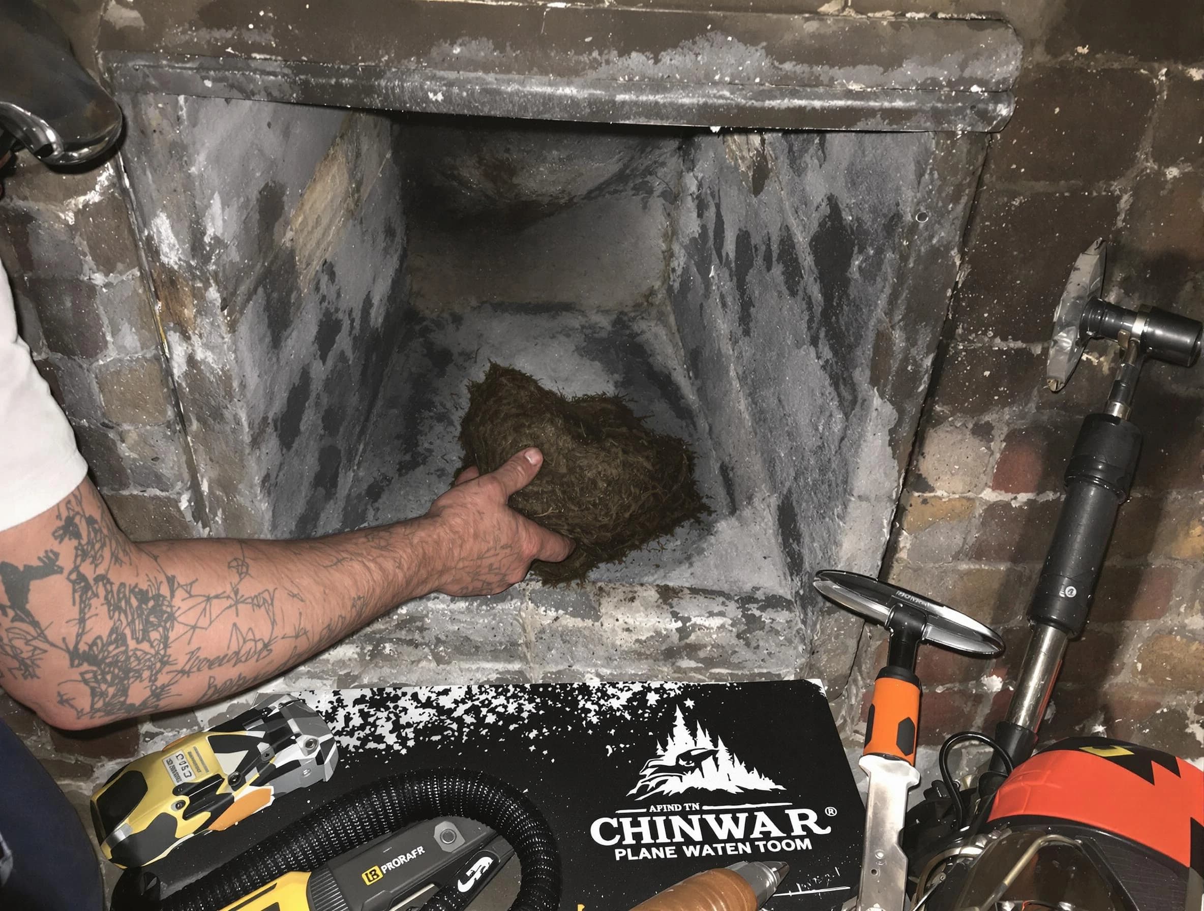 Eagle Mountain Chimney Sweep safely removing debris and screening chimney in Eagle Mountain, UT